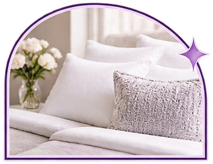 A bedroom with crisp white linens, framed in the Fifth Ave Maids arch